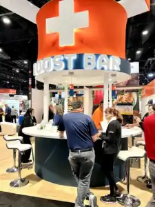 People standing around a Circular booth counter.