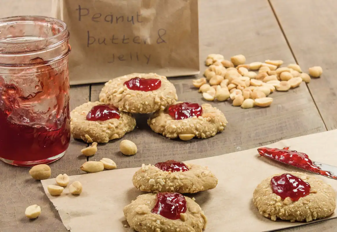 Peanut butter cookies topped with jam.