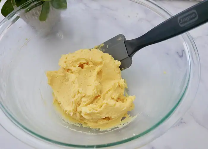 Jogue Bourbon Pecan Shortbread cookie batter being mixed in glass bowl.