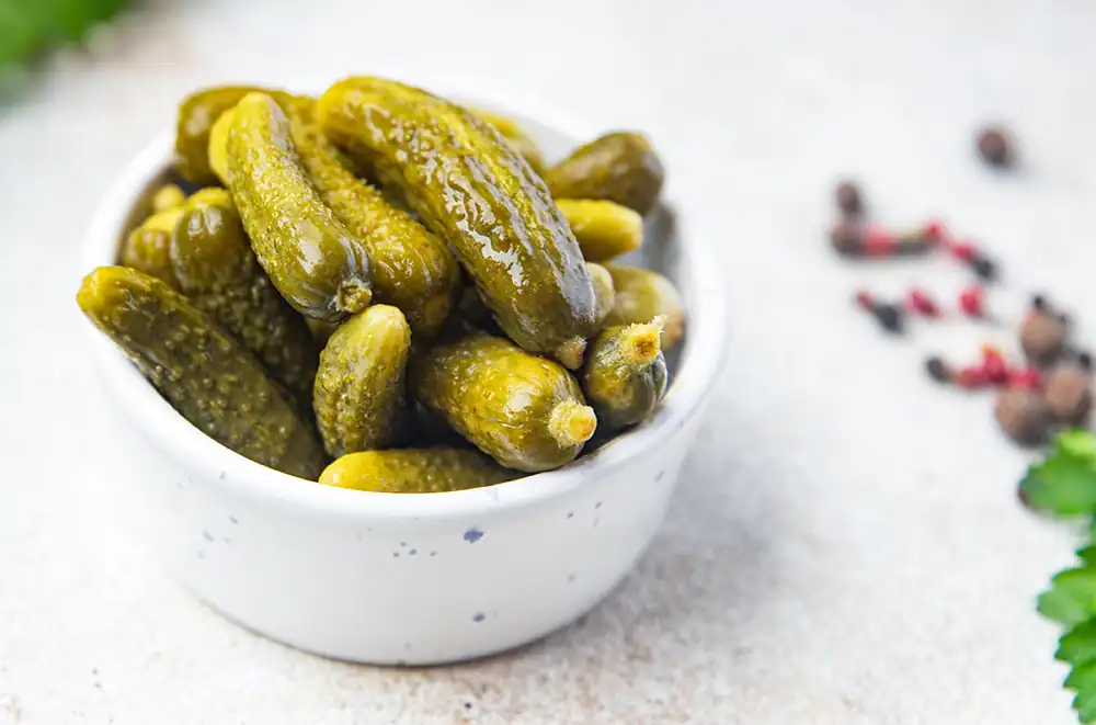 A bowl of pickles.